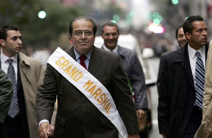Surrounded by security, Scalia walks in the annual Columbus Day Parade on October 10, 2005, in New York City.