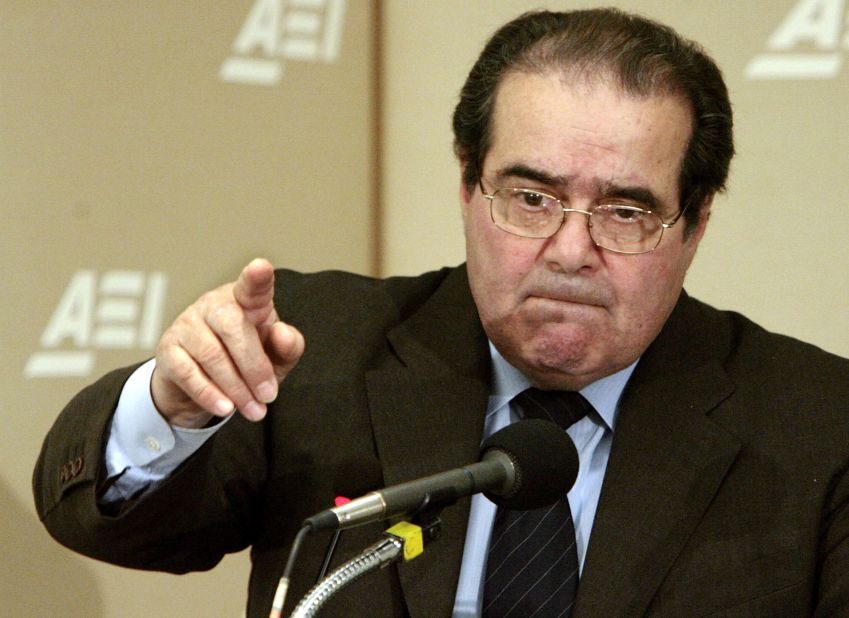 Scalia calls on people during a question-and-answer period at the American Enterprise Institute on February 21, 2006, in Washington. Scalia delivered the keynote address about foreign law and the debate about how it is used in American Law during the seminar called "Outsourcing Of American Law."