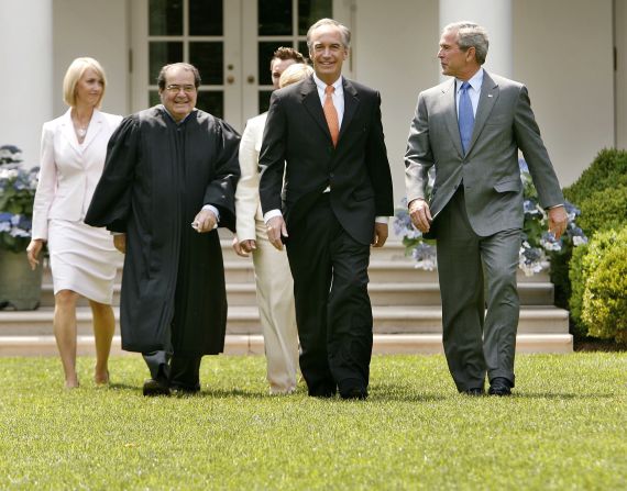 Heather Myklegard, Scalia, Dirk Kempthorne and U.S. President George W. Bush walk through the Rose Garden before Kempthorne is sworn in as the new interior secretary at White House on June 7, 2006, in Washington.