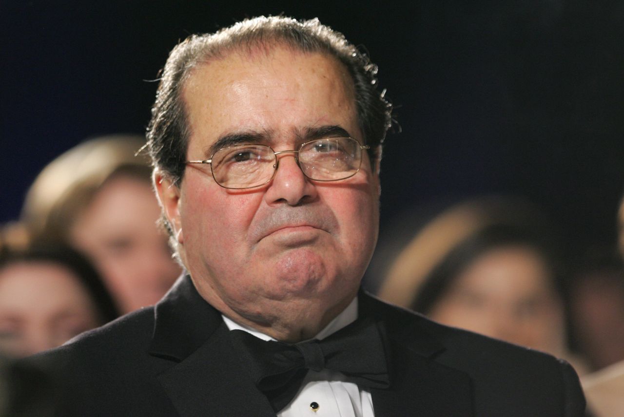 Scalia listens as U.S. President George W. Bush speaks at the the Federalist Society's 25th Anniversary Gala Dinner at Union Station in Washington, on November 15, 2007. 