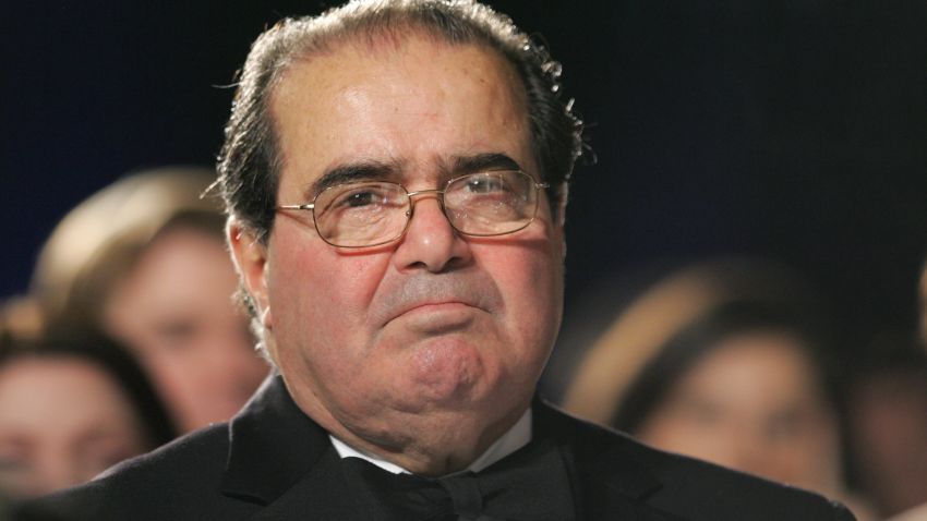 US Supreme Court Justice Antonin Scalia listens as US President George W. Bush speaks at the the Federalist Society's 25th Anniversary Gala Dinner at Union Station in Washington, DC 15 November 2007. AFP PHOTO/SAUL LOEB (Photo credit should read SAUL LOEB/AFP/Getty Images)