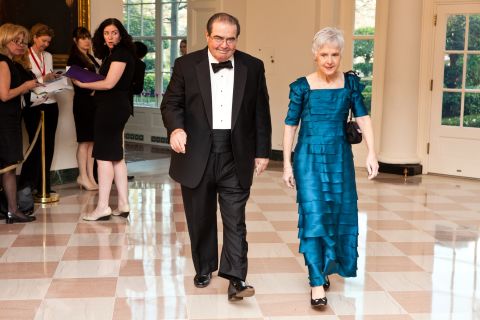 Scalia and  his wife, Maureen, arrive for a state dinner in honor of British Prime Minister David Cameron at the White House on March 14, 2012, in Washington.