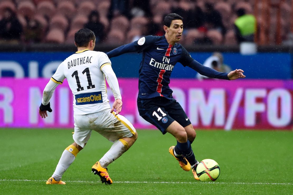 Paris Saint-Germain forward Angel Di Maria (R) vies for the ball with Lille's French midfielder Eric Bautheac.