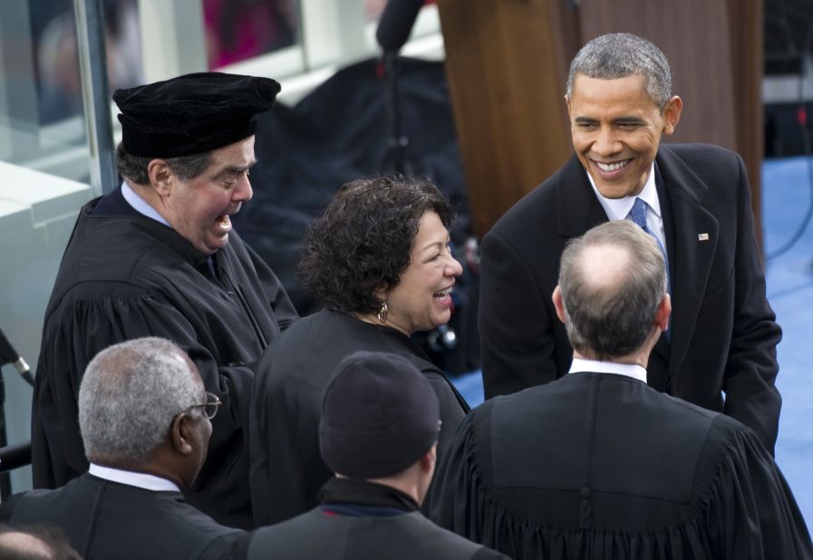 U.S. President Barack Obama greets Supreme Court Justices Clarence Thomas, Antonin Scalia, Sonia Sotomayor, Anthony Kennedy and John Roberts at Obama's inauguration for his second term of office. 