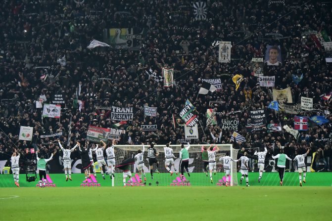 Juventus' players celebrate with fans at the end of the hard fought encounter.