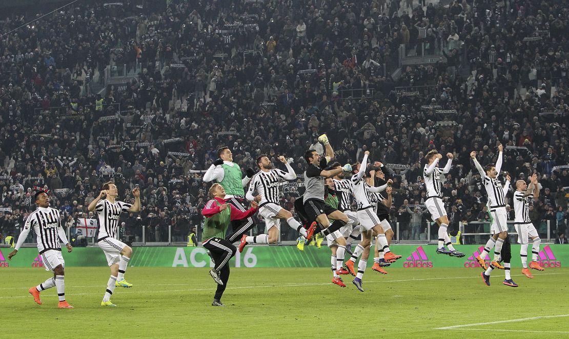 Juventus players celebrate after defeating title rival Napoli.