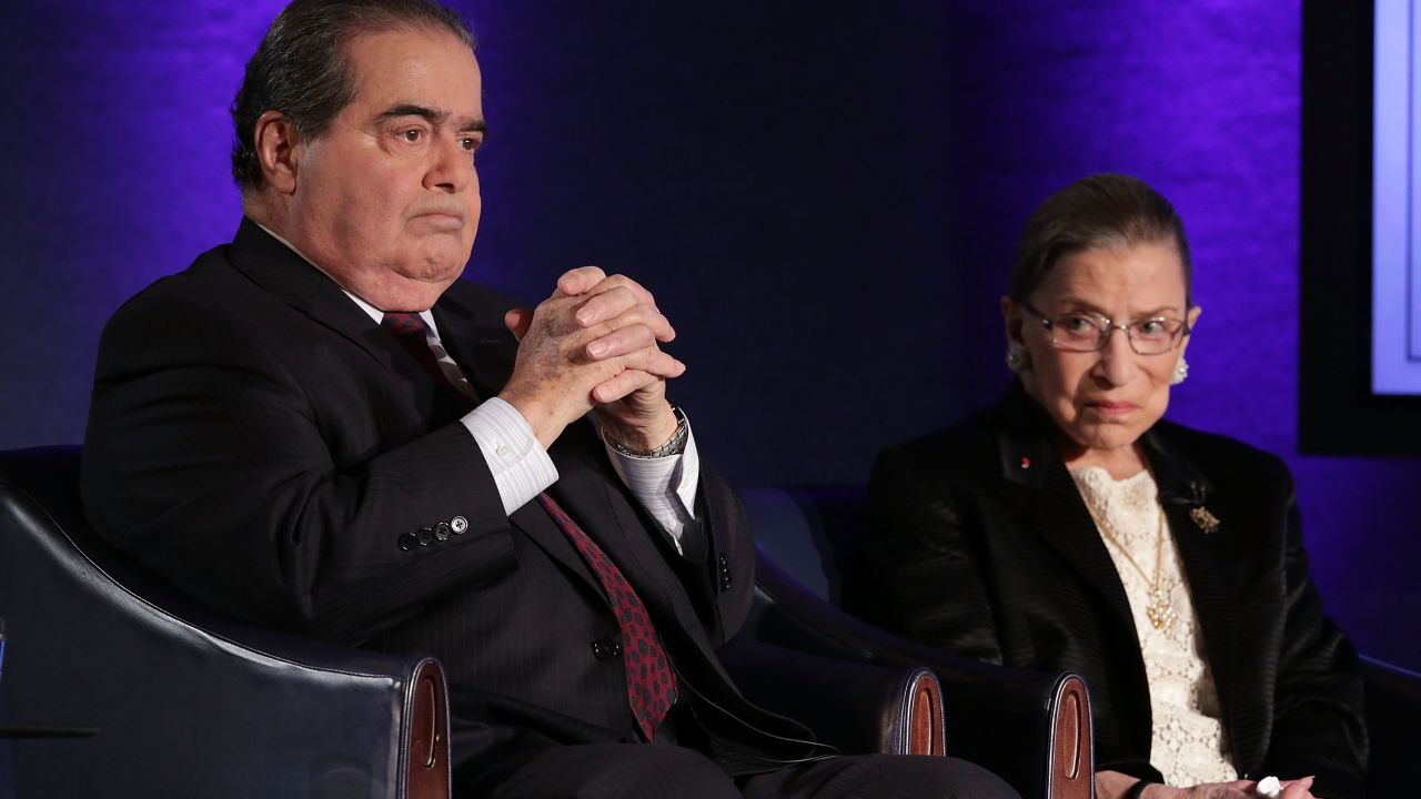 Supreme Court Justices Antonin Scalia (L) and Ruth Bader Ginsburg (R) wait for the beginning of the taping of "The Kalb Report" April 17, 2014 at the National Press Club in Washington, DC.