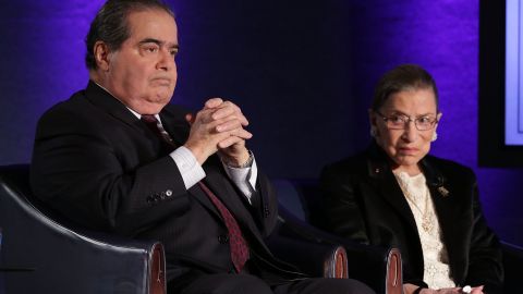 Supreme Court Justices Antonin Scalia (L) and Ruth Bader Ginsburg (R) wait for the beginning of the taping of "The Kalb Report" April 17, 2014 at the National Press Club in Washington, DC.  