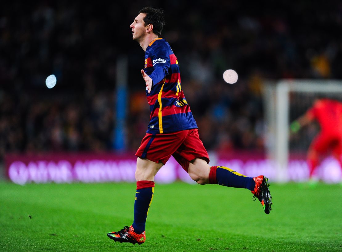 Messi celebrates after putting Barcelona ahead in the Nou Camp with a superb free kick.