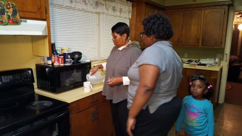 Glynis Watson Cephus, left, makes coffee with bottled water. Her daughter Sydney Cephus and granddaughter Hailey Birdon don't drink the tap water, either. 