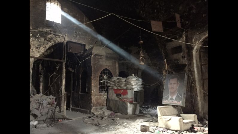 SYRIA: A portrait of Syrian President Bashar al-Assad lies in a burnt our building used by government forces in the Old Town of Aleppo. Photo by CNN's Fred Pleitgen <a href="index.php?page=&url=http%3A%2F%2Finstagram.com%2Ffpleitgencnn" target="_blank" target="_blank">@fpleitgencnn</a>. 