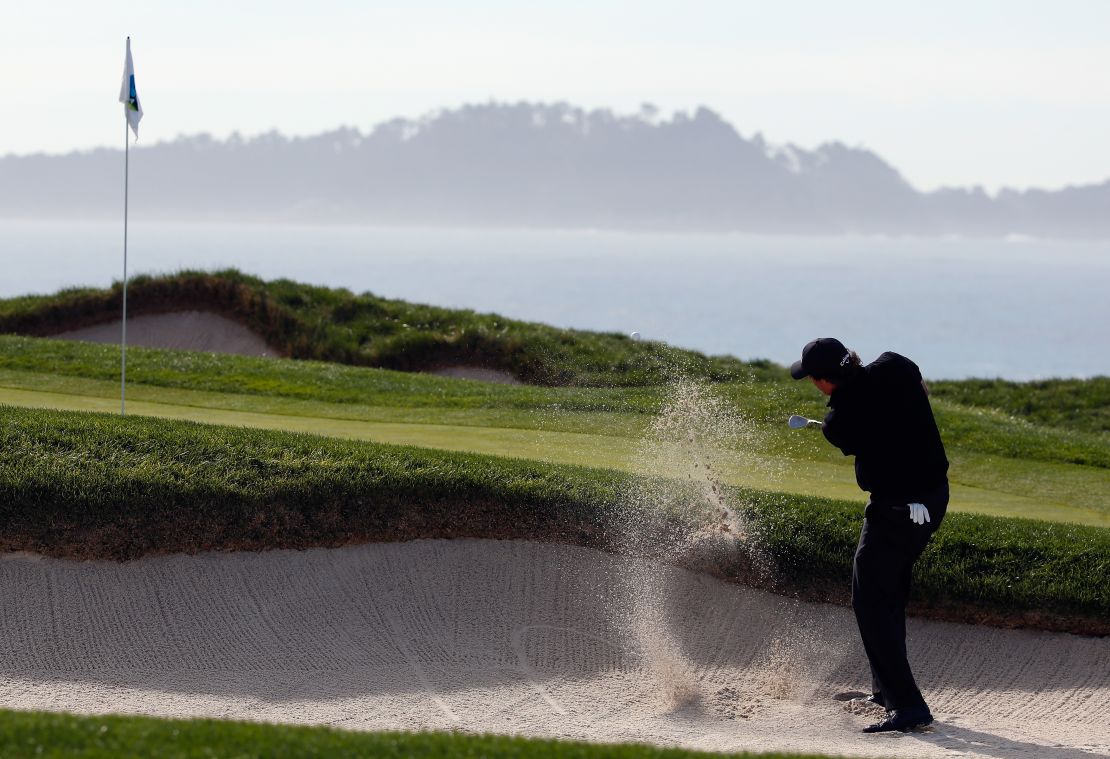 Mickelson plays out of the bunker on the fourth as he makes the first of two consecutive bogeys Sunday.
