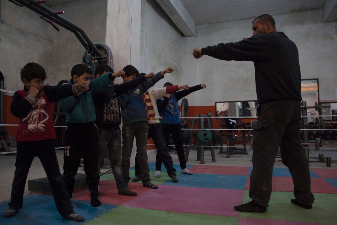 Boys line up and mimic Kattan, who became Syria's national champion only one year after taking up boxing professionally in 1994. Kattan opened the club with colleague Ahmad Mashallah to improve their form, and to give young fighters a chance to learn.