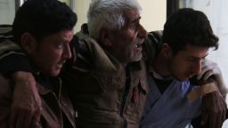 A Syrian man reacts as he receives treatment at a makeshift hospital following reported air strikes in the city of Azaz, on Syria's northern border with Turkey, on February 15, 2016.