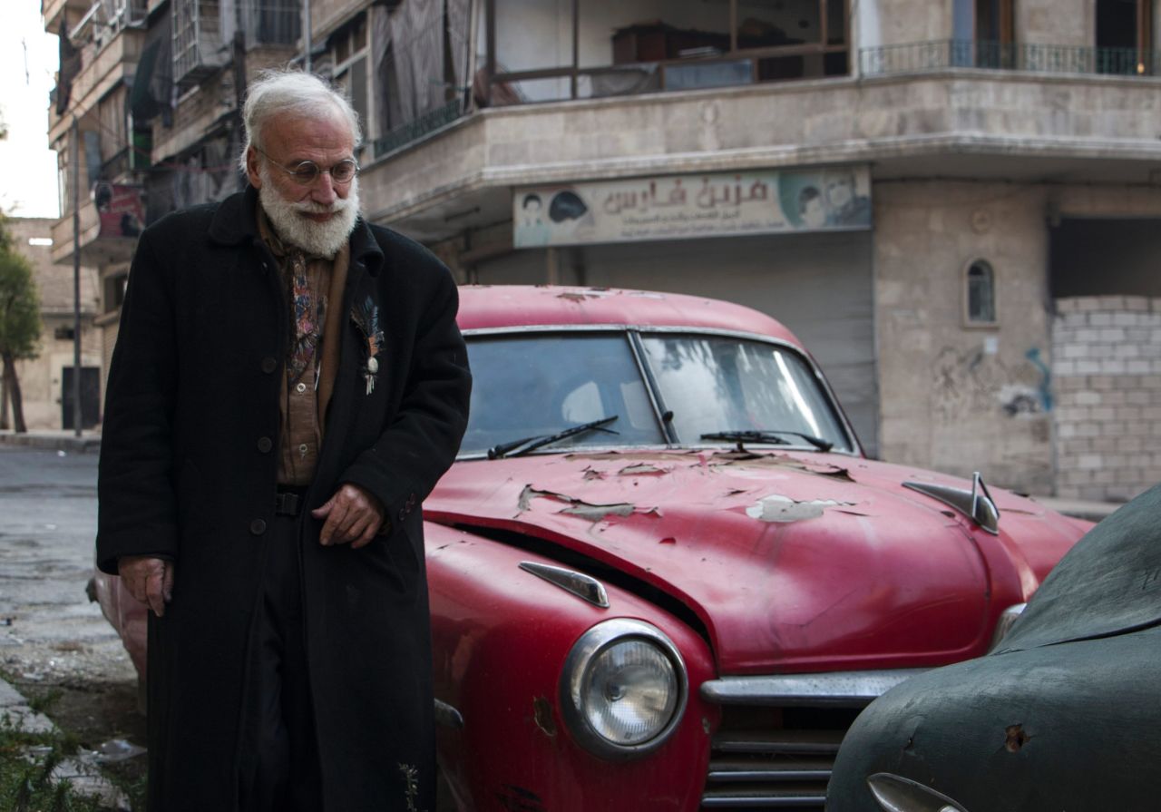 The 69-year-old's family fled fighting in Aleppo, but he stayed behind to care for his cars.