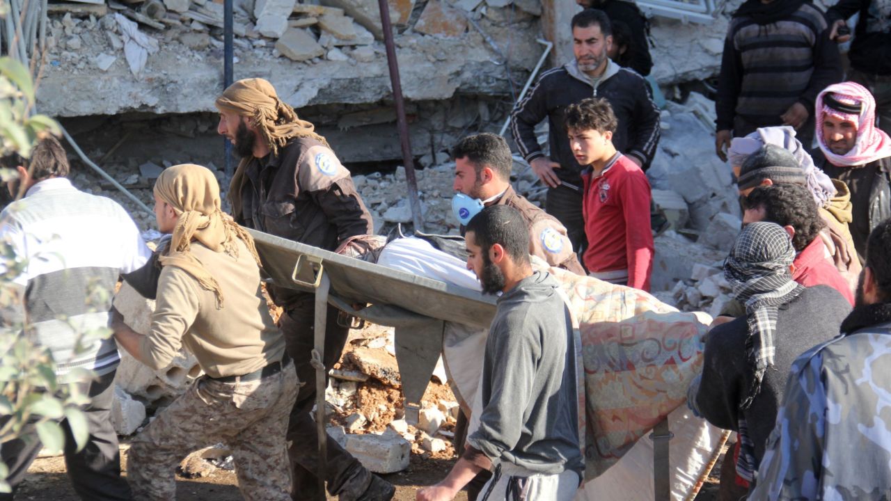 A victim is carried on a stretcher after the strike on the hospital in Maarat al-Numan, Idlib province.