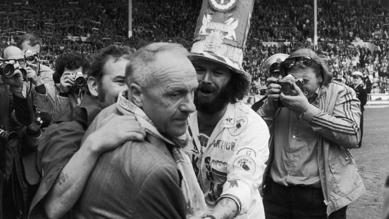 Bill Shankly receives the praise of jubilant Liverpool fans after defeating Leeds United in the 1974 Charity Shield match.