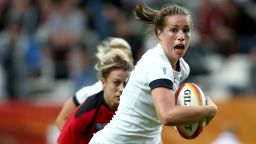 PARIS, FRANCE - AUGUST 17:  Emily Scarratt of England breaks free of a challenge from Mandy Marchak of Canada during the IRB Women's Rugby World Cup 2014 Final between England and Canada at Stade Jean-Bouin on August 17, 2014 in Paris, France.  (Photo by Jordan Mansfield/Getty Images)