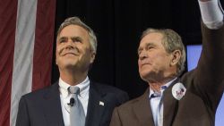 Former US President George W. Bush (R) waves with his wife Laura (L) as he stands with his brother and Republican presidential candidate Jeb Bush during a campaign rally in Charleston, South Carolina, February 15, 2016.