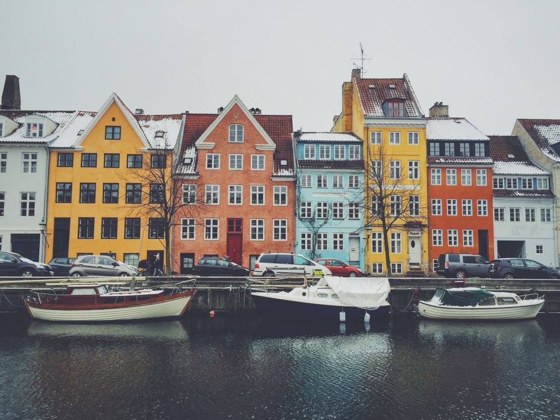 Houses stretch along a canal in Copenhagen
