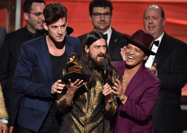 "Uptown Funk," Mark Ronson featuring Bruno Mars. Holding the Grammy between the two is producer Jeff Bhasker. The song also won the Grammy for best pop duo/group performance.