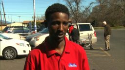 Reginald Gray, 26, buys bottled water to bathe his 5-month-old son. 