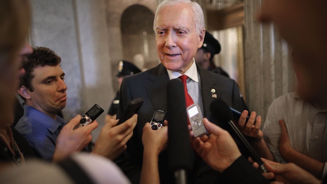 Sen. Orrin Hatch, a Utah Republicam talks with reporters after leaving the Senate floor at the US Capitol May 18, 2015 in Washington.