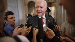 Sen. Orrin Hatch (R-UT) (C) talks with reporters after leaving the Senate floor at the U.S. Capitol May 18, 2015 in Washington, DC.