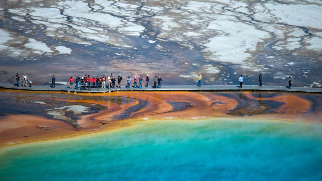 <a href="http://www.cnn.com/2013/08/15/travel/yellowstone-summer-in-the-park/">Yellowstone National Park</a> was the world's first national park when it was created in 1872. Barely anyone could get there until the railroads connected people to the park in the 1880s.  More than 4 million people visited last year, often walking the Midway Geyser Basin boardwalk to see the Grand Prismatic geothermal pool. Yellowstone is home to about half of the world's geysers. 
