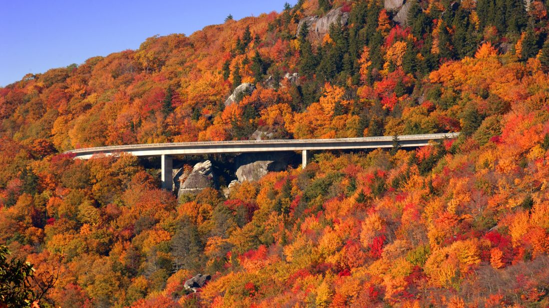 The Blue Ridge Parkway tops  <a href="http://www.cnn.com/specials/travel/nps-100">National Park Service</a>'s list of most-visited sites in 2015, drawing more than 15 million visits. Fall foliage on the parkway's Linn Cove Viaduct in North Carolina is shown here. Click through the gallery to see the nine other most popular sites.