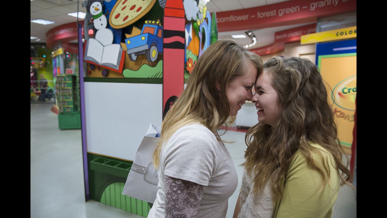 Klein and Lauryn laugh together during a trip to the mall.