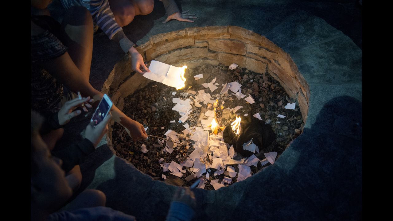 Klein attended a residential treatment center for two months. At the end of an alumnae retreat, they burn pieces of paper where they had written down things they want to let go of.