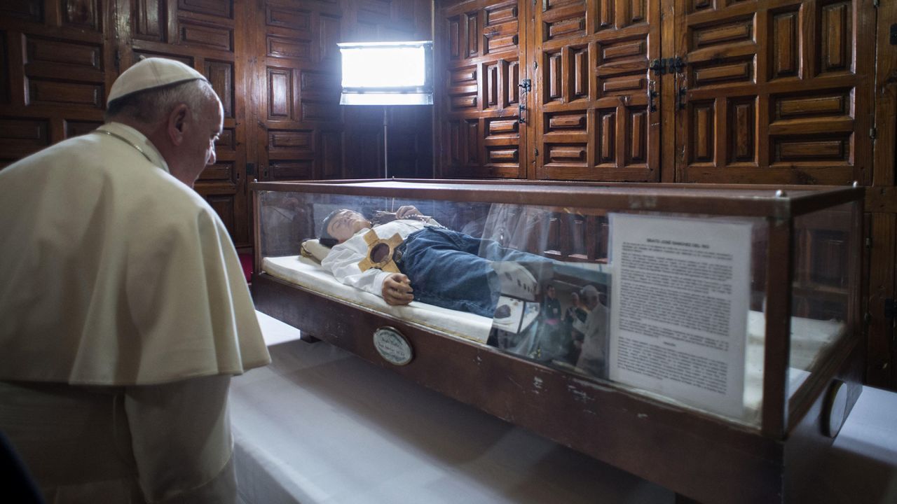 Pope Francis pays his respects to Jose Sanchez del Rio at a cathedral in Morelia, Mexico, on Tuesday, February 16. Jose, 14, was killed by government officials in 1928 after he refused to renounce his Catholic faith.