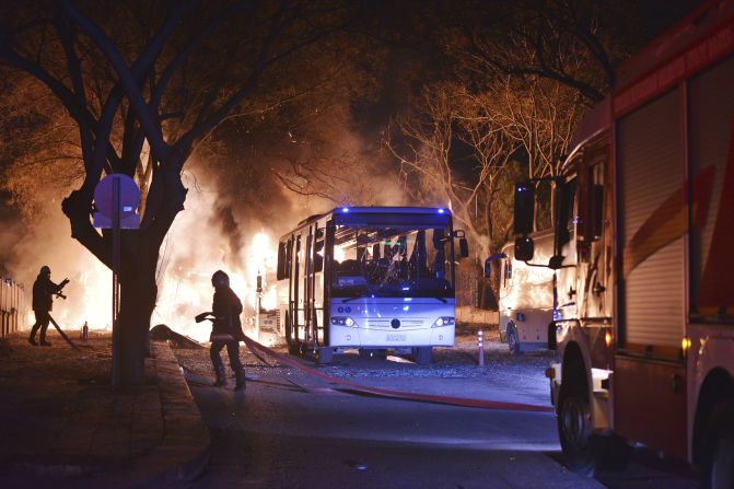 Firefighters work at the scene of a deadly explosion in Ankara, Turkey, on Wednesday, February 17. The explosion hit three military vehicles and a private vehicle near parliament buildings, reported Turkey's semiofficial Anadolu news agency.