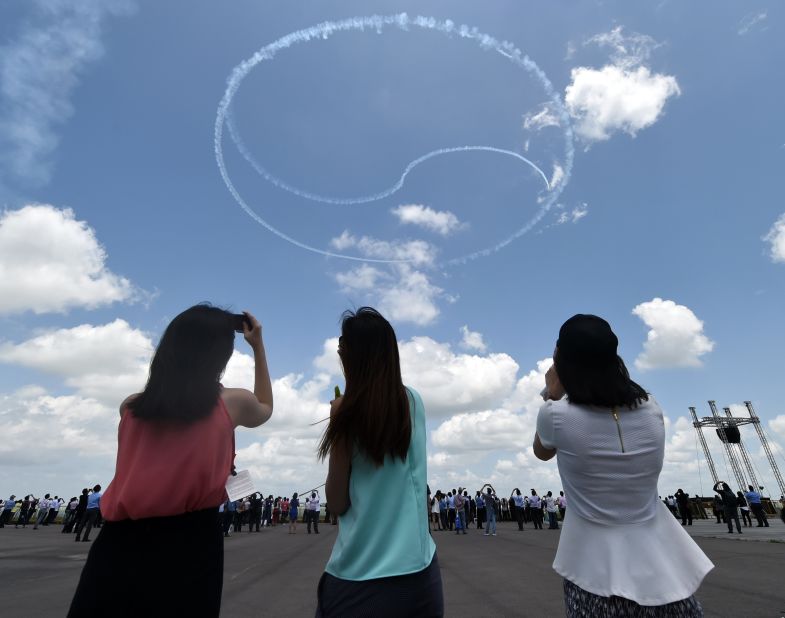 South Korea's Black Eagles aerobatics team forms a yin and yang circle, resembling the flag of South Korea, during the Singapore Airshow on February 16.