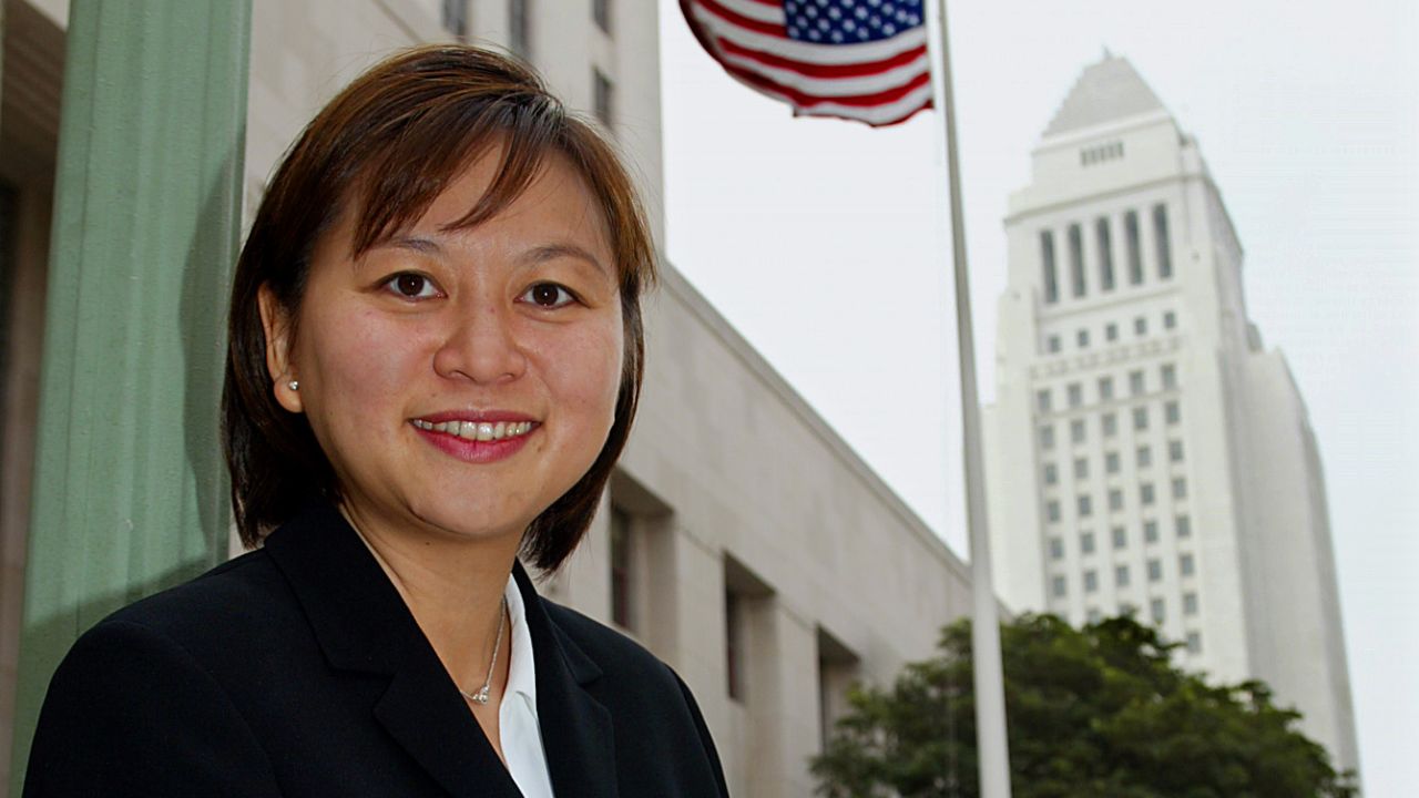 JACQUELINE NGUYEN is the first Vietnamese American woman named to the state court in California. Photo of Nguyen outside court with Los Angeles city hall in background, August 15, 2002