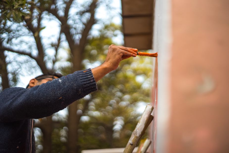 Amitabh Kumar painting "Dead Dahlias." This festival has turned the entire Lodhi District into India's first "art district." <em>(Photograph by Akshat Nauriyal)</em>