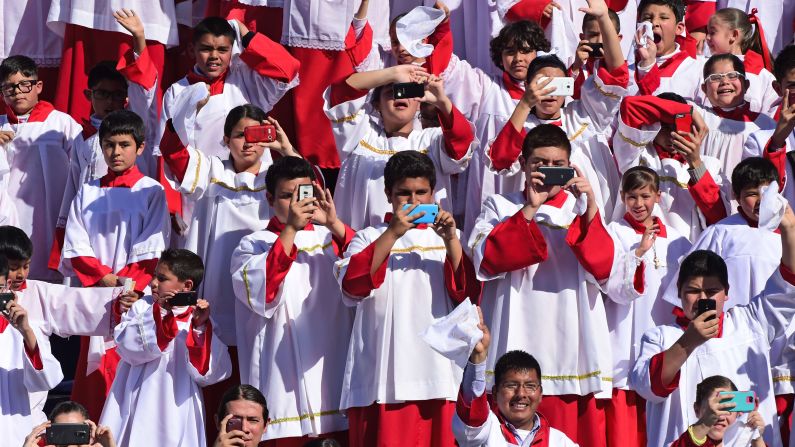 Altar boys cheer as the Pope arrives in Ciudad Juarez on February 17.