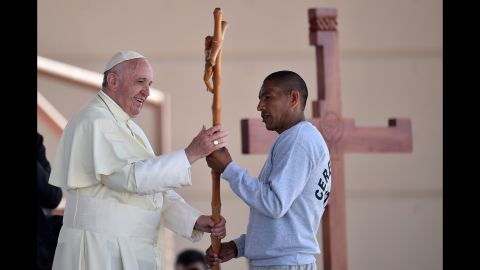 Pope Francis receives a cross made by an inmate at a prison in Ciudad Juarez on February 17.