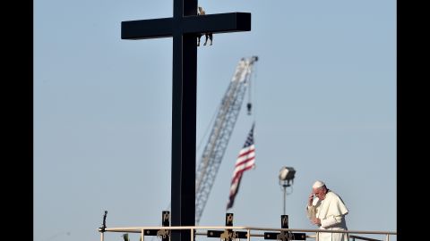 Pope Francis prays next to the U.S. border before celebrating Mass in Ciudad Juarez, Mexico, on Wednesday, February 17. The Pope's five-day trip to Mexico started on February 12.