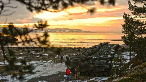 U.S. Marine Corps amphibious assault vehicles assemble before a public "splash" demonstration in the Trondheim Fjord in Norway in January.