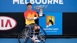 MELBOURNE, AUSTRALIA - JANUARY 30:  Gordon Reid of Great Britain poses with the championship trophy after winning the Men's Wheelchair Singles Final match against Joachim Gerard of Belgium during the Australian Open 2016 Wheelchair Championships at Melbourne Park on January 30, 2016 in Melbourne, Australia.  (Photo by Darrian Traynor/Getty Images)