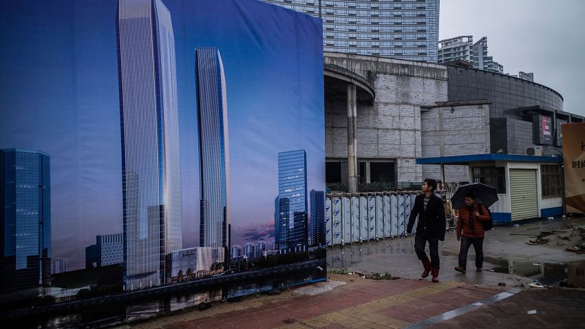 DONGGUAN, CHINA - JANUARY 27:  People walk on a street at Houjie town on January 27, 2016 in Dongguan, China. China's slowing economy and falling stock market have caused concerns for investors worldwide and many factories in manufacturing hub such as Dongguan have either closed down or reduced its number of staff. Official data reported its annual growth of 6.9 percent in 2015, the slowest pace in 25 years, and stock markets continue to plunge since the new year.  (Photo by Lam Yik Fei/Getty Images)