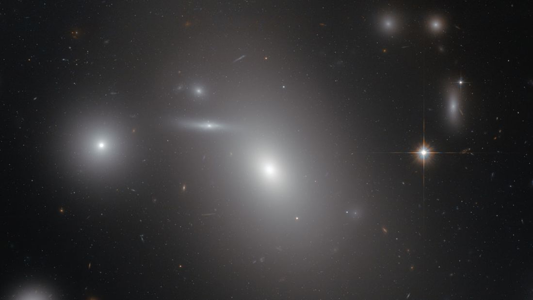 This image shows the elliptical galaxy NGC 4889, deeply embedded within the Coma galaxy cluster. There is a gigantic supermassive black hole at the center of the galaxy.