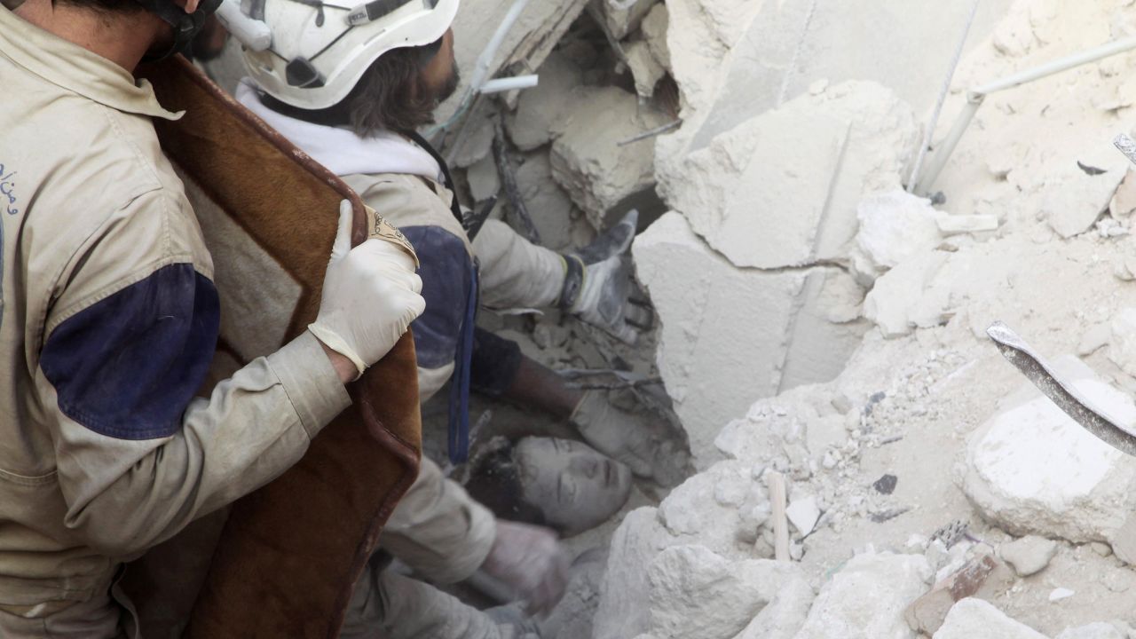Workers rescue a girl from the rubble after airstrikes hit a rebel-held neighborhood of Aleppo, Syria, on Sunday, February 14.