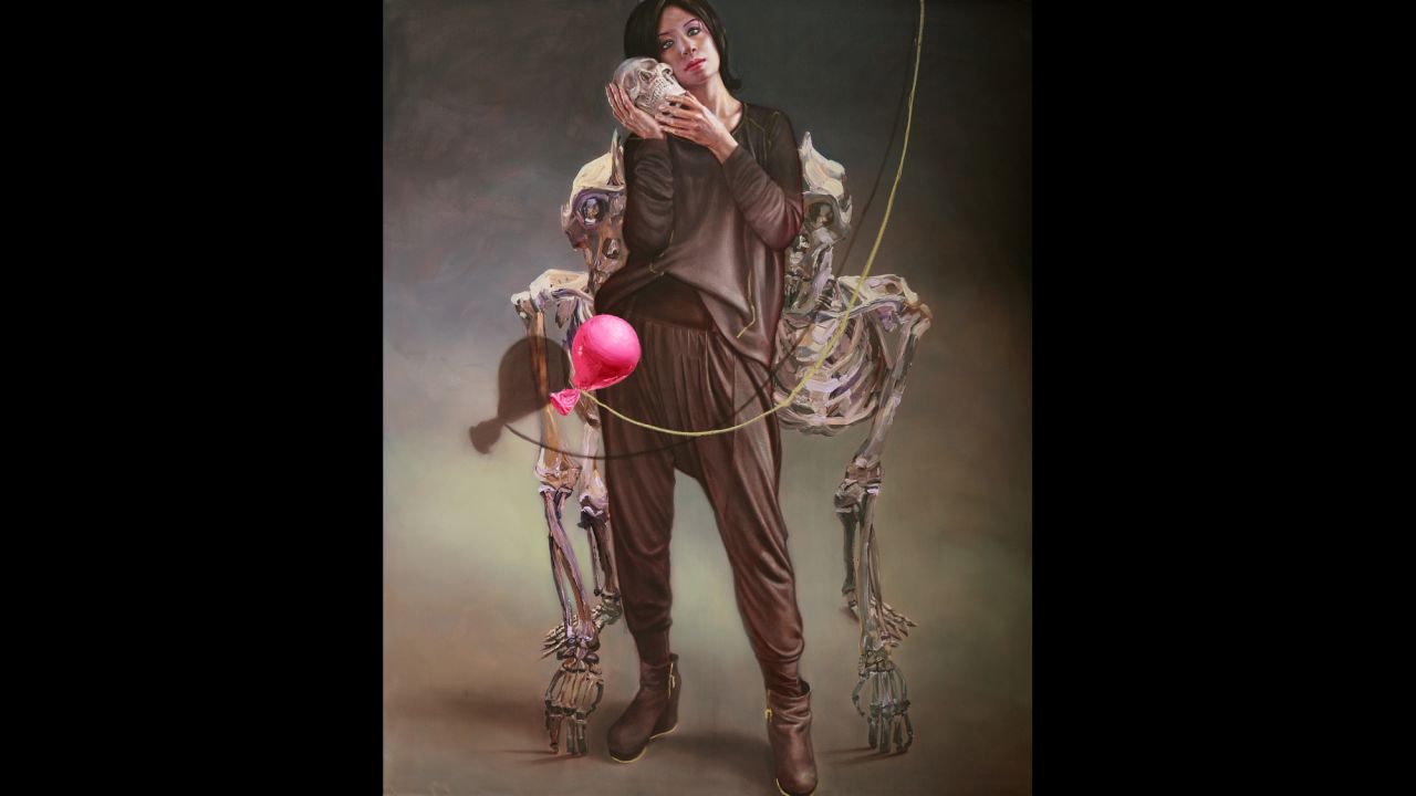 "Self portrait" shows the artist holding a skull. Shamma says she often uses a mirror when she paints.