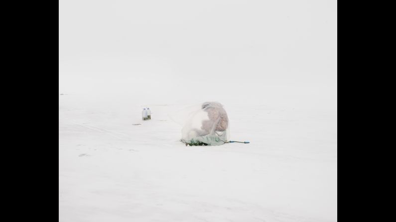 "They're so focused on this practice of ice fishing and they're so cut off from their surroundings," Kondratyev said. "They're isolated by this plastic bag that abstracts their figure."