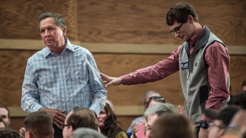 CLEMSON, SC - FEBRUARY 18: University of Georgia student Brett Smith (R) reaches out to Republican presidential candidate John Kasich after sharing a story about suicide at a town hall meeting at Clemson University February 18, 2016 in Clemson, South Carolina. The South Carolina Republican primary will be held Saturday, February 20. (Photo by Sean Rayford/Getty Images)