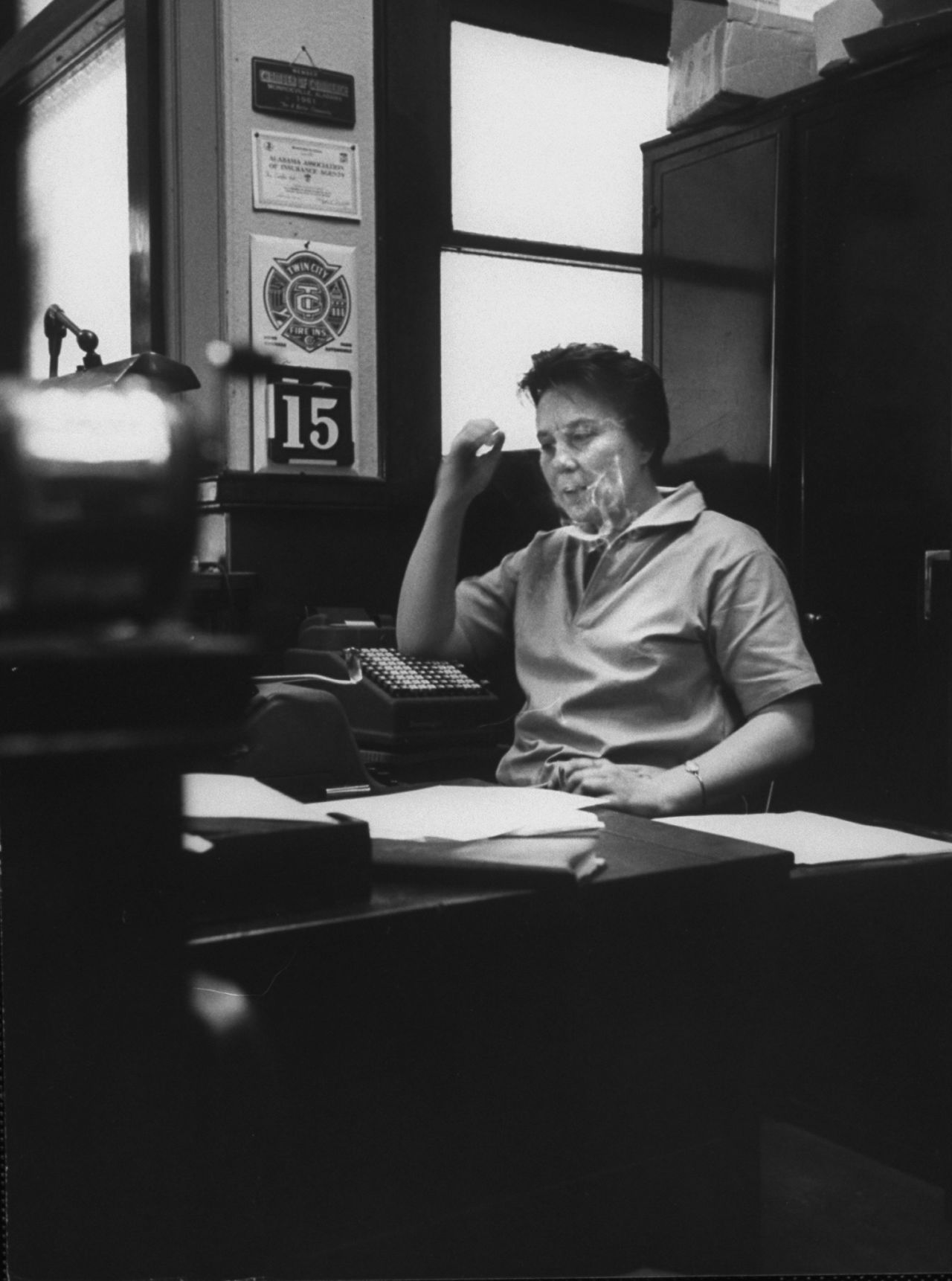 "To Kill a Mockingbird" author Harper Lee sits in her father's law office in this undated photo. News of her death was reported on Friday, February 19. She was 89.