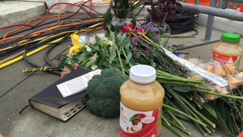Outside the Supreme Court on February 19, 2016, mourners leave flowers and jars of applesauce — a nod to an Justice Antonin Scalia's dissent in which he wrote that the majority's opinion was "pure applesauce."
